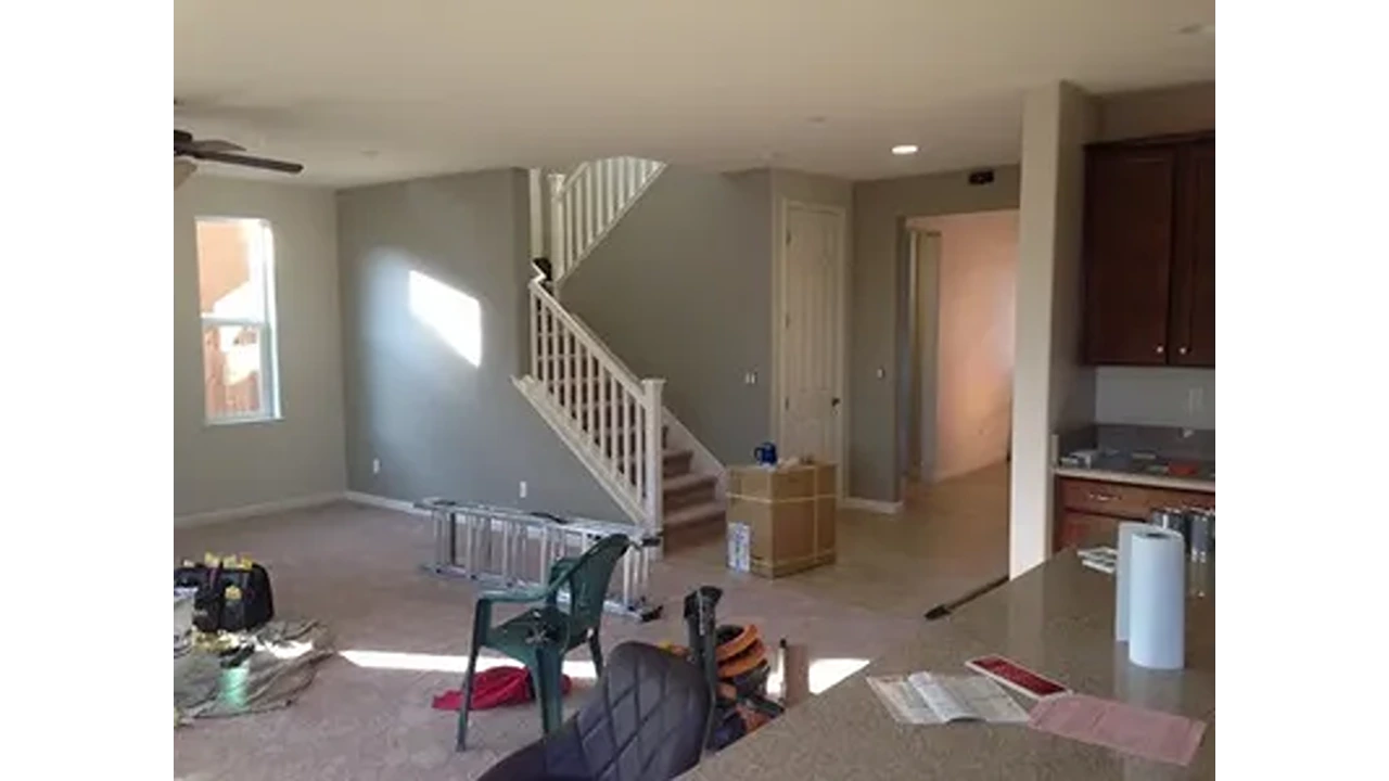 A room with stairs and a chair in it