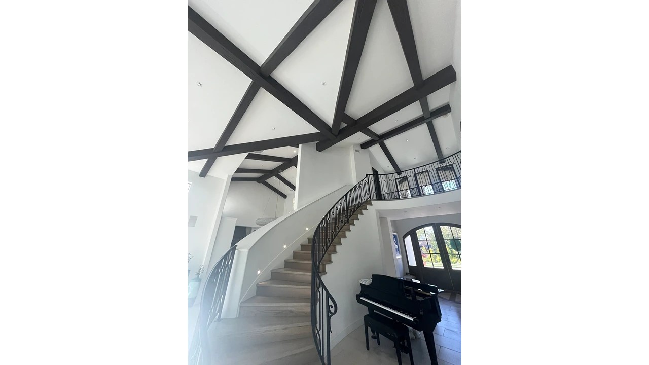 A grand piano in the middle of a staircase.
